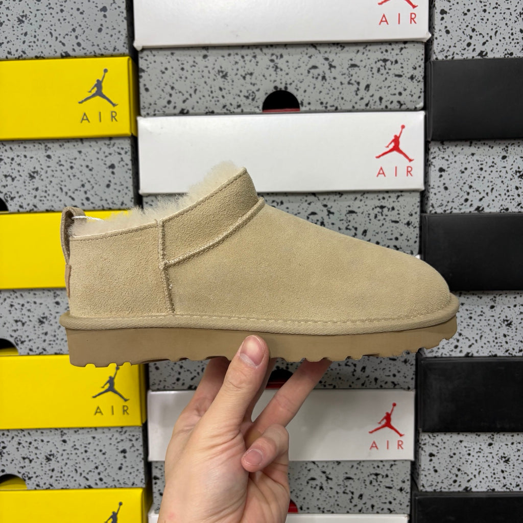 UGG Fluffy-Lined Slip-On Shoes in Sand