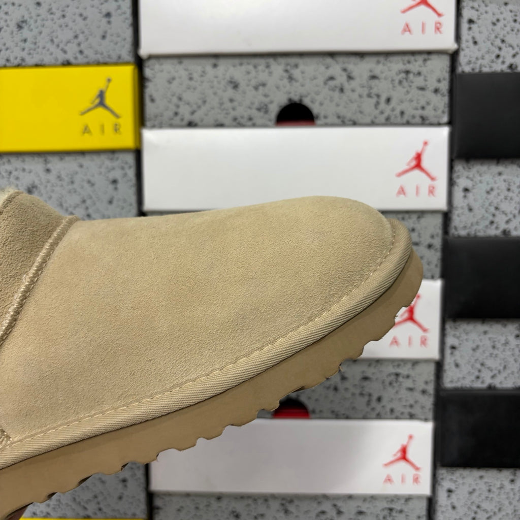 UGG Fluffy-Lined Slip-On Shoes in Sand