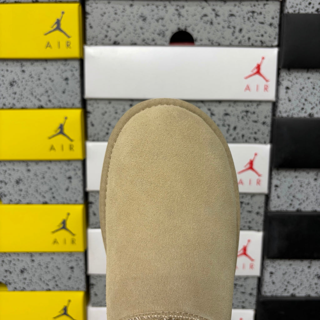 UGG Fluffy-Lined Slip-On Shoes in Sand