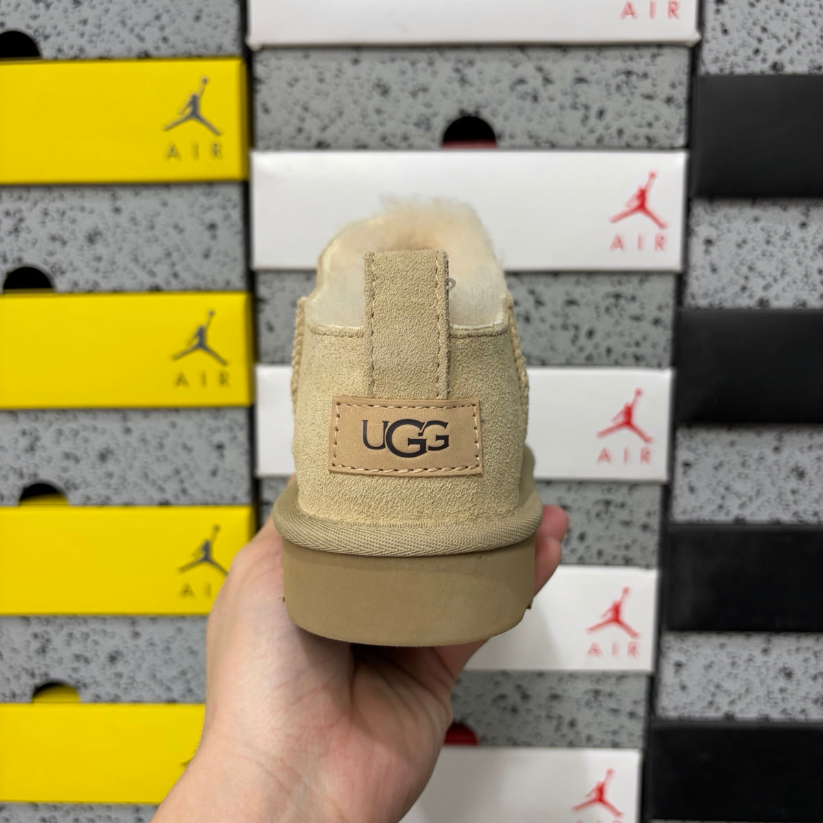 UGG Fluffy-Lined Slip-On Shoes in Sand